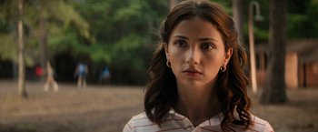 Movie still from “Fear Street: Part Two - 1978” (2021), directed by Leigh Janiak – A person wearing a white shirt; Close Up shot, Over the shoulder angle