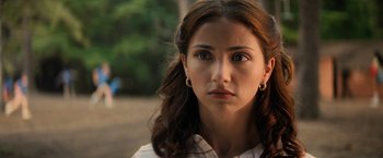 Movie still from “Fear Street: Part Two - 1978” (2021), directed by Leigh Janiak – A person wearing a white shirt; Close Up shot, Over the shoulder angle