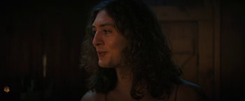 Movie still from “Fear Street: Part Two - 1978” (2021), directed by Leigh Janiak – A person with long curly hair; Close Up shot, Over the shoulder angle