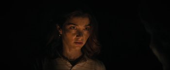 Movie still from “Fear Street: Part Two - 1978” (2021), directed by Leigh Janiak – A woman with long brown hair is in the dark; Close Up shot, Low angle