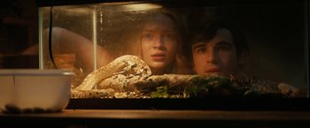 Movie still from “Fear Street: Part Two - 1978” (2021), directed by Leigh Janiak – A man and a woman are looking at a snake; Close Up shot, Low angle