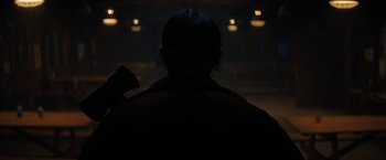 Movie still from “Fear Street: Part Two - 1978” (2021), directed by Leigh Janiak – A person with a microphone in a dark room; Close Up shot, Over the shoulder angle