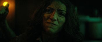 Movie still from “Fear Street: Part Two - 1978” (2021), directed by Leigh Janiak – A person's face in a dark room; Close Up shot, Low angle