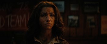 Movie still from “Fear Street: Part Two - 1978” (2021), directed by Leigh Janiak – A person wearing a shirt with dirt all over her face; Close Up shot, Low angle