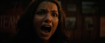 Movie still from “Fear Street: Part Two - 1978” (2021), directed by Leigh Janiak – A person with blood on their face; Close Up shot, Overhead angle