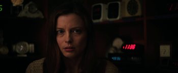 Movie still from “Fear Street: Part Two - 1978” (2021), directed by Leigh Janiak – A person in a dark room; Close Up shot, Low angle