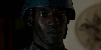 Movie still from “Black Mirror” (2011), created by Charlie Brooker – A person wearing a helmet; Close Up shot, Over the shoulder angle