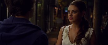 Movie still from “Friends with Benefits” (2011), directed by Will Gluck – A woman in a white dress talking to a man in a blue shirt; Close Up shot, Over the shoulder angle