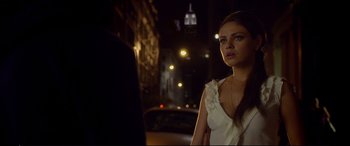Movie still from “Friends with Benefits” (2011), directed by Will Gluck – A woman standing on the side of the road at night; Close Up shot, Over the shoulder angle
