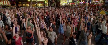 Movie still from “Friends with Benefits” (2011), directed by Will Gluck – A large group of people standing on the street; Extreme Wide shot, High angle
