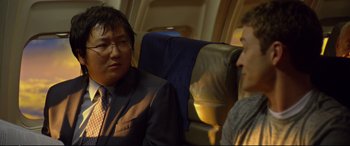 Movie still from “Friends with Benefits” (2011), directed by Will Gluck – A man and a woman are sitting on a plane; Close Up shot, Over the shoulder angle