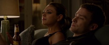Movie still from “Friends with Benefits” (2011), directed by Will Gluck – A woman sitting next to a man on a couch; Close Up shot, Over the shoulder angle