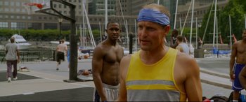 Movie still from “Friends with Benefits” (2011), directed by Will Gluck – A man with a blindfold standing next to another man; Medium shot, Over the shoulder angle