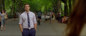Movie still from “Friends with Benefits” (2011), directed by Will Gluck – A man standing on the side of a road with his hands in his pockets; Medium shot, Low angle