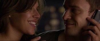 Movie still from “Friends with Benefits” (2011), directed by Will Gluck – Two people smiling at each other; Close Up shot, Over the shoulder angle