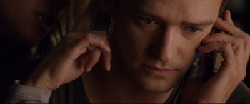 Movie still from “Friends with Benefits” (2011), directed by Will Gluck – A person talking on a cell phone; Close Up shot, Over the shoulder angle