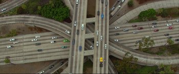 Movie still from “Friends with Benefits” (2011), directed by Will Gluck – An aerial view of a highway with many cars on it; Extreme Wide shot, Overhead angle