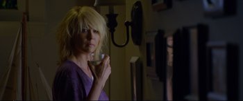Movie still from “Friends with Benefits” (2011), directed by Will Gluck – A woman is holding a cup of coffee; Close Up shot, Over the shoulder angle