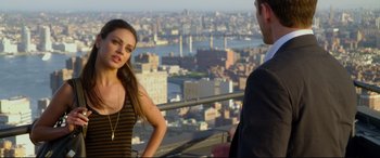 Movie still from “Friends with Benefits” (2011), directed by Will Gluck – A woman standing next to a man on top of a building; Medium shot, Over the shoulder angle