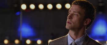 Movie still from “Friends with Benefits” (2011), directed by Will Gluck – A man in a suit and tie; Close Up shot, Over the shoulder angle