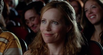 Movie still from “Funny People” (2009), directed by Judd Apatow – A person with long brown hair; Close Up shot, Over the shoulder angle