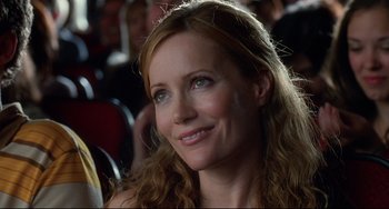 Movie still from “Funny People” (2009), directed by Judd Apatow – A person sitting in a crowd; Close Up shot, Over the shoulder angle