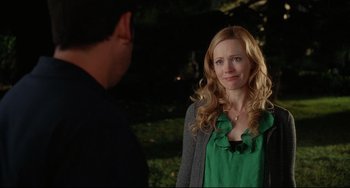 Movie still from “Funny People” (2009), directed by Judd Apatow – A woman standing next to a man in a green shirt; Medium shot, Over the shoulder angle