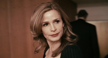 Movie still from “Gamer” (2009), directed by Mark Neveldine – A person with long hair; Close Up shot, Over the shoulder angle