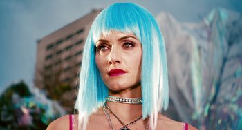 Movie still from “Gamer” (2009), directed by Mark Neveldine – A person wearing a blue wig; Close Up shot, Low angle