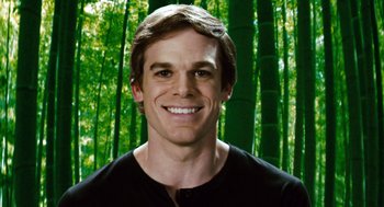 Movie still from “Gamer” (2009), directed by Mark Neveldine – A young man smiling in front of a bamboo forest; Close Up shot, Low angle