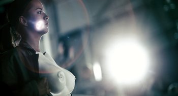 Movie still from “Gamer” (2009), directed by Mark Neveldine – A woman is standing in front of a mirror; Close Up shot, Low angle