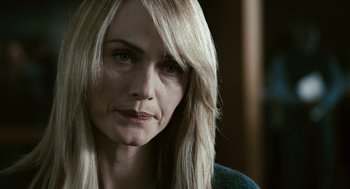 Movie still from “Gamer” (2009), directed by Mark Neveldine – A person with long blonde hair; Close Up shot, Over the shoulder angle