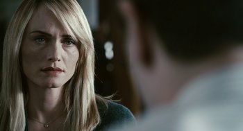 Movie still from “Gamer” (2009), directed by Mark Neveldine – A person with long blonde hair; Close Up shot, Over the shoulder angle