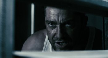 Movie still from “Gamer” (2009), directed by Mark Neveldine – A person looking at the camera; Close Up shot, Low angle