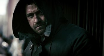 Movie still from “Gamer” (2009), directed by Mark Neveldine – A person wearing a hooded jacket; Close Up shot, Low angle