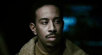 Movie still from “Gamer” (2009), directed by Mark Neveldine – A person wearing a jacket; Close Up shot, High angle