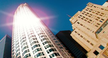 Movie still from “Gamer” (2009), directed by Mark Neveldine – The sun is shining through the windows of a skyscraper; Extreme Wide shot, Low angle