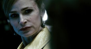 Movie still from “Gamer” (2009), directed by Mark Neveldine – A person wearing a yellow jacket; Close Up shot, Over the shoulder angle