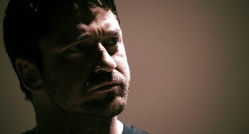 Movie still from “Gamer” (2009), directed by Mark Neveldine – A person with a beard; Close Up shot, Low angle