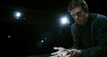 Movie still from “Gamer” (2009), directed by Mark Neveldine – A man with his hands in the dark; Close Up shot, Low angle