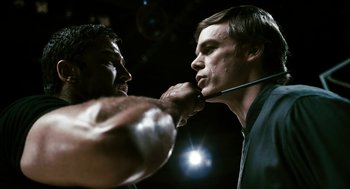 Movie still from “Gamer” (2009), directed by Mark Neveldine – Two men are fighting in a boxing match; Close Up shot, Over the shoulder angle