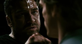 Movie still from “Gamer” (2009), directed by Mark Neveldine – A man looking at himself in the mirror; Close Up shot, Over the shoulder angle