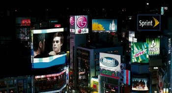 Movie still from “Gamer” (2009), directed by Mark Neveldine – A view of a city at night from a high vantage point; Extreme Wide shot, High angle