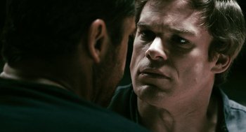 Movie still from “Gamer” (2009), directed by Mark Neveldine – A person looking into a mirror; Close Up shot, Over the shoulder angle