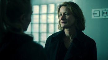 Movie still from “Ganglands” (2021), created by Julien Leclercq – A woman in a black jacket is talking to another woman; Close Up shot, Over the shoulder angle