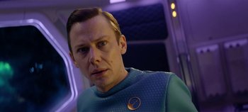 Movie still from “Black Mirror” (2011), created by Charlie Brooker – A man wearing a blue shirt and a blue tie; Close Up shot, Over the shoulder angle