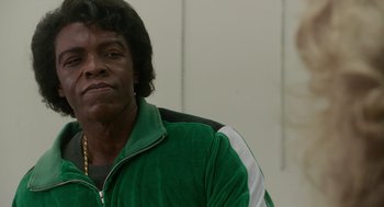 Movie still from “Get on Up” (2014), directed by Tate Taylor – A person wearing a green jacket; Close Up shot, Over the shoulder angle