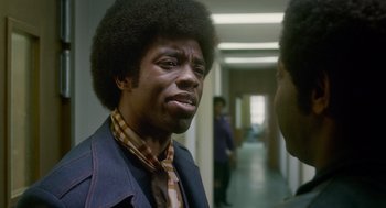 Movie still from “Get on Up” (2014), directed by Tate Taylor – A man in a suit and tie talking to another man in a suit and tie; Close Up shot, Over the shoulder angle