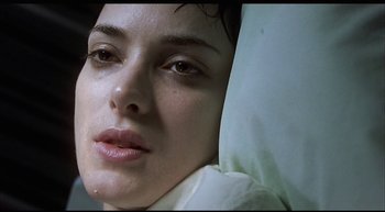 Movie still from “Girl, Interrupted” (1999), directed by James Mangold – A woman's face with her eyes closed; Close Up shot, Overhead angle