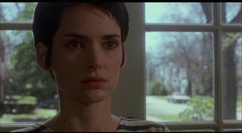 Movie still from “Girl, Interrupted” (1999), directed by James Mangold – A person with short black hair; Close Up shot, Over the shoulder angle